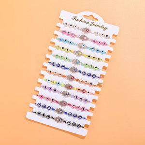 12 pcs Rope HAMSA hand evil eye bracelet / 12 piezas de pulcera de hilo con mano de Fatima y ojo Turco Multicolor
