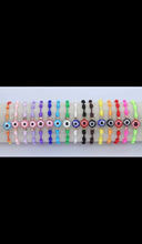 Load image into Gallery viewer, 12 pieces multicolor evil eye bracelet / Pulceras multicolor con ojo turco