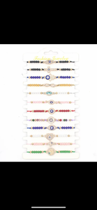 12 pieces of multicolor evil eye bracelets.