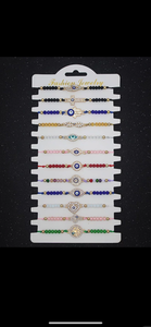 12 pieces of multicolor evil eye bracelets.