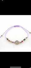 Load image into Gallery viewer, 12 pieces of multicolor evil eye bracelets.
