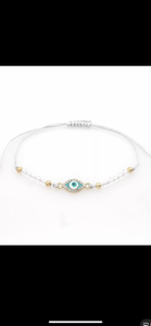 12 pieces of multicolor evil eye bracelets.