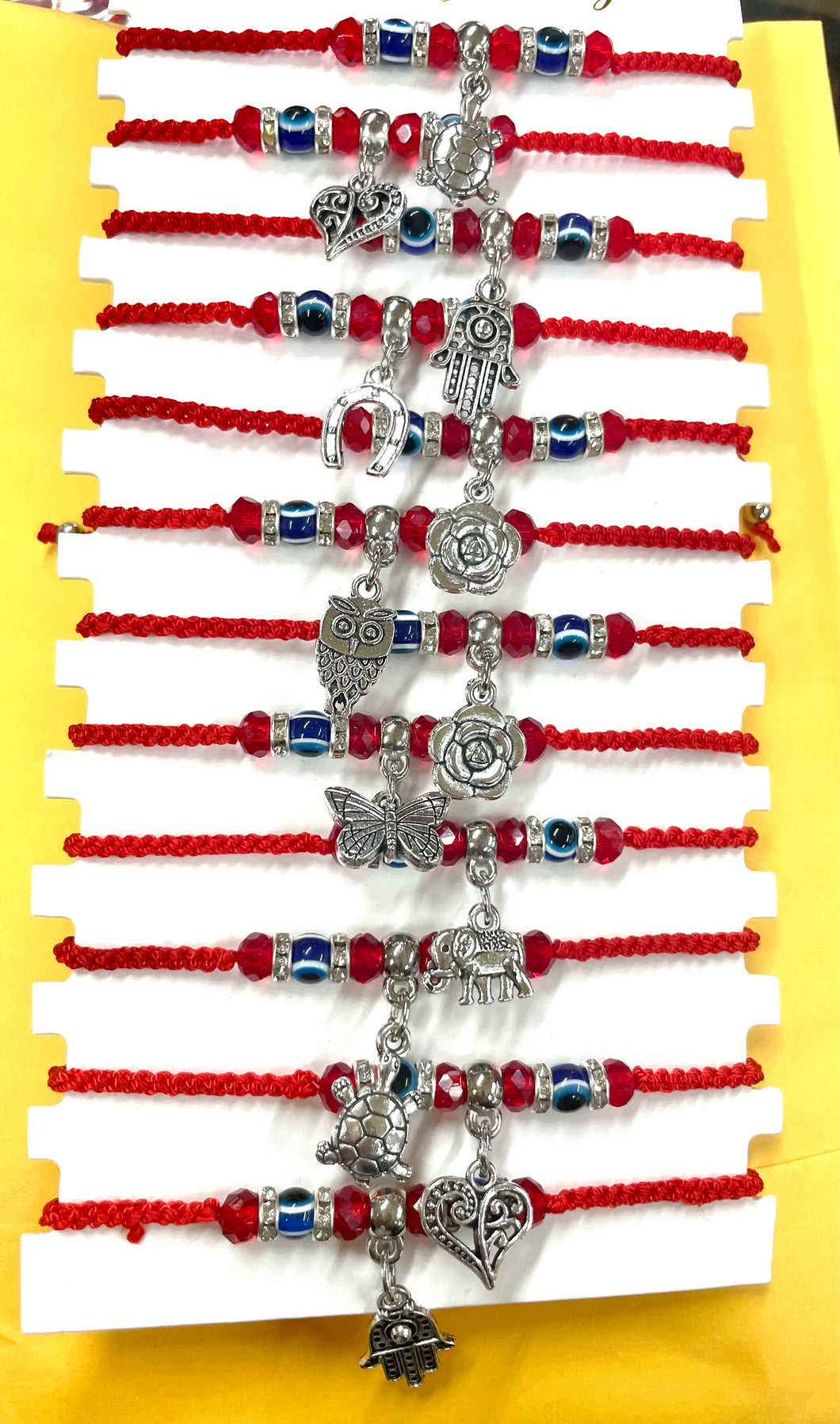 12 piezas de pulseras de mano, corazon, elefante, herradura, tortuga, buho y rosa. Surtido mixto.