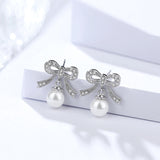 925 sterling silver bow earrings female Korean temperament small pearl beads micro stud earrings cross-border